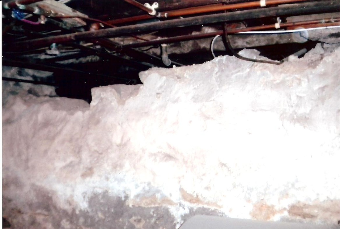 Basement wall with loose, failing cement